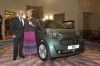 2011-07_Pour_leur_50eme_Anniversaire2C_Sir_Stirling_Moss_offre_une_Aston-Martin_Cygnet_a_son_epouse.jpg